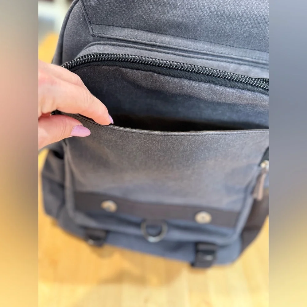 Gray Canvas Crossbody Backpack with Brown Accents Multiple Compartments Durable